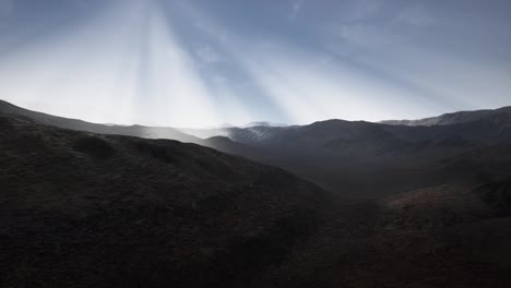 Sun-Rays-over-Mountains-in-a-Valley